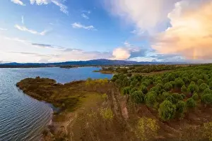 Lake drone aerial view of mountain panorama landscape at sunset in Marateca Dam in Castelo Branco, Portugal