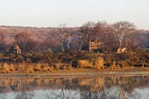 Daybreak Prints: Across a lake in India the morning sun lights up an abandoned hunting lodge