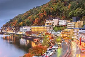 Lake Kawaguchi, Yamanashi, Japan with resorts along the lakeside at dusk in autumn