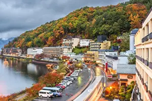 Lake Kawaguchi, Yamanashi, Japan with resorts along the lakeside at dusk in autumn