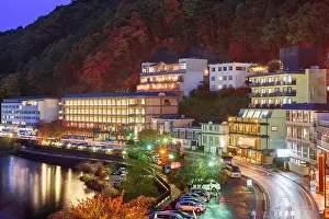 Lake Kawaguchi, Yamanashi, Japan with resorts along the lakeside at dusk in autumn