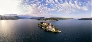 Lago Prints: Lake Orta Italy. Aerial view of a beautiful mountain lake with small basilica church and castle