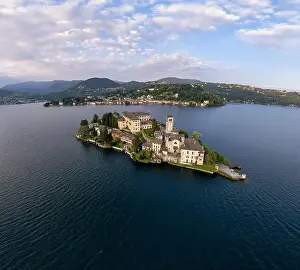 Lago Prints: Lake Orta Italy. Aerial view of a beautiful mountain lake with small basilica church and castle