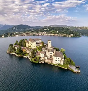 Lago Prints: Lake Orta Italy. Aerial view of a beautiful mountain lake with small basilica church and castle