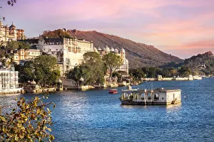 Water Tourism Prints: Lake Pichola with City Palace view at pink sunset sky in Udaipur, Rajasthan, India