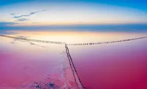 Mirrored Prints: Lake with pink healing salt water on a background of sunset and sunrise