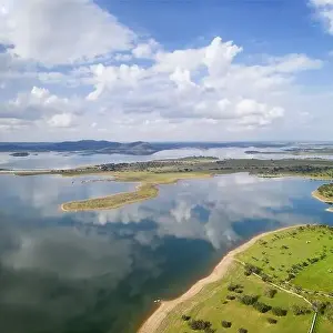 Lake reservoir water reflection drone aerial view of Alqueva Dam landscape and in Alentejo, Portugal