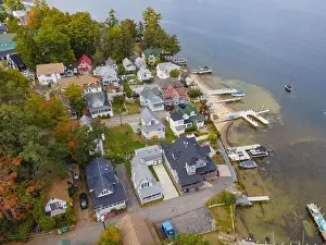 Lake Winnipesaukee and village of Weirs Beach aerial view with fall foliage in City of Laconia, New Hampshire NH, USA