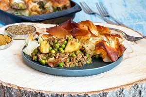 Almond Prints: Lamb samosa pie - popular Indian dish with a savoury filling