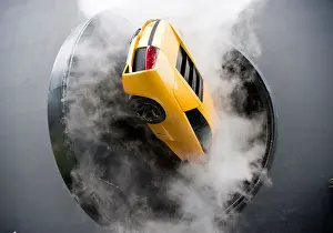 Showroom Prints: Lamborghini supercar on revolving door with smoke during display show at Autostadt Volkswagen car museum in Wolfsburg
