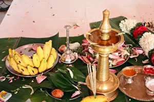 Garland Prints: Lamp kept lighted during marriage ceremony in a traditional kerala wedding as religious custom