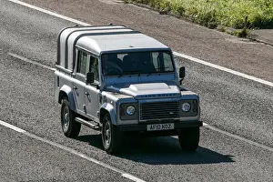 Expressway Prints: Land Rover Defender 110 Xs Dc Lwb Silver LCV traveling on the M61 motorway near Manchester