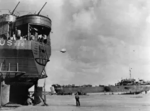Landing Craft Prints: Landing craft unloading onto the sand at low tide on D-Day