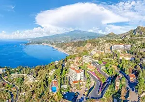 Rocky Coast Prints: Landscape with Etna volcano and Taormina town aerial panoramic view, Sicily, Italy