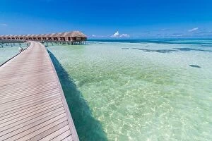 Images Dated 12th December 2015: landscape of Maldives beach. Tropical panorama, luxury water villa resort with wooden pier jetty