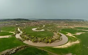 Landscape photo about curving Sajo river and Sajoszentpeter town on the background in North Hungary