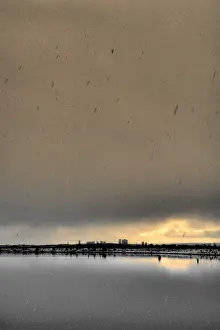 Miserable Prints: landscape picture of silhouetted city buildings in bleak miserable winter weather