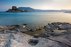 Dodecanese Prints: Landscape with rocky coastline and islet at sunset in Kos island, Greece