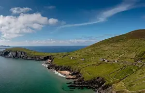 Landscape view of the turquoise waters and golden sand beach at Slea Head on the Dingle Peninsula of County Kerry
