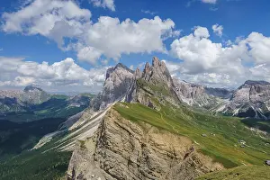 Trekking Prints: Landscapes in Seceda with mountain clouds and blue sky in Dolomites mountain range in summer