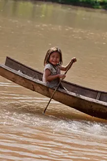 Canoe Prints: Lanten girl in her dugout canoe on the Nam Ha River, Luang Nam Tha, Laos