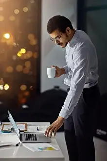 Portfolio Prints: Laptop, night coffee and businessman reading feedback review of financial portfolio