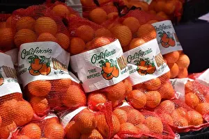 Oranges Prints: Large bags of fresh oraganic California oranges at an outdoor market