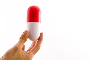 Pharmaceutical Prints: a large capsule representing big pharma