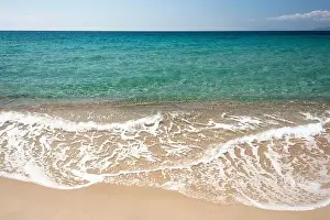 Humid Prints: large golden sand dunes and crystal clear water at Piscinas beach