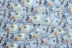 Earn Prints: A large number of US dollar bills of a new design with a blue stripe in the middle