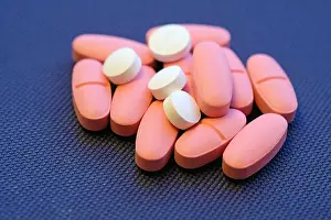 Nutritional Prints: Large pink oval-shaped tablets and small white round tablets