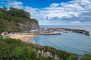 Iberia Prints: Lastres, Spain – View of the harbor and beach in Asturias