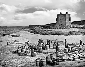 Eire Prints: A late 19th-century photograph of locals curing fish in the harbour at Clare Island at the entrance to Clew Bay