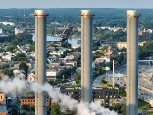 Emissions Prints: Late afternoon summer aerial image of the power plant located downtown Providence RI, USA