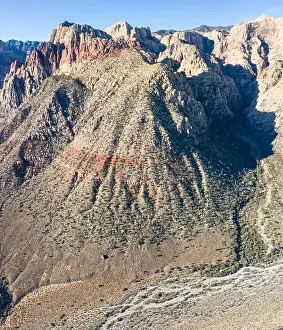 Late afternoon sunlight creates contrast on the gullies and ravines of the rocky, high desert not far from Las Vegas, Nevada