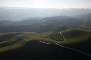 Late afternoon sunlight illuminates the beautiful hills and valleys found in Livermore, California. This area is not far east of San Francisco Bay