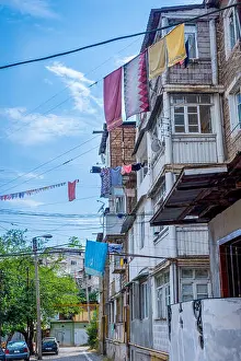 Rental Prints: Laundry drying outside attached on the rope from the apartment building in Stepanakert