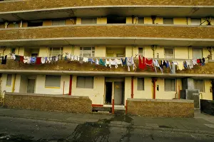 Frontage Prints: LAUNDRY ON WASHING LINES HANGING ALONG BALCONY OF A DERELICT HOUSING BLOCK, LIVERPOOL