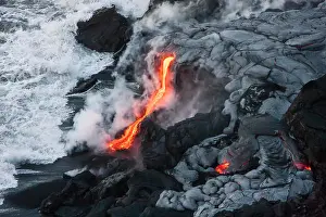 Intense Prints: Lava comes out of lava tubes and meets ocean water on Big Island, Hawaii