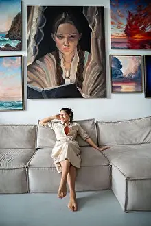 Satisfied Prints: Lazy pleased woman relaxing at home studio