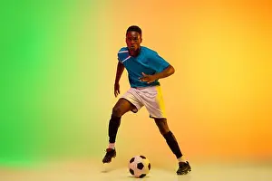 Kicking Prints: Leader. African-american male soccer