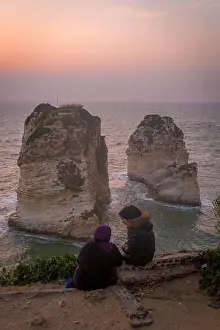 Lebanon Prints: Two Lebanese female friends watching sunsets on the scenic Raouche shore of Mediterranean sea in Beirut
