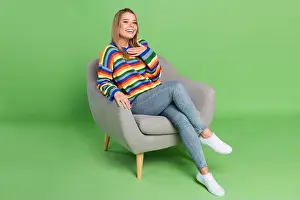 Sincere Prints: Full length body size photo girl sitting in chair casual clothes laughing hand on chest isolated pastel green color