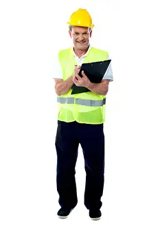 Folder Prints: Full length portrait of an old age architect holding documents and writing something