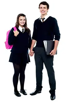 Schoolbag Prints: Full length portrait of students in uniform ready to go school with backpack and files