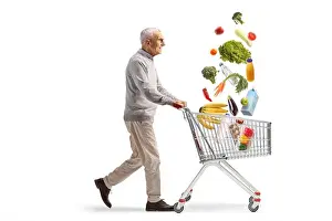 Shopper Prints: Full length profile shot of an elderly man walking