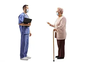 Patient Prints: Full length profile shot of an elderly woman talking to a medical worker with a face mask isolated on white background