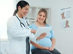 Lets check that precious heartbeat and movements. a doctor during a consultation with a pregnant patient in a clinic