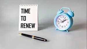 Alarm Clock Prints: On a light background, a notebook with the inscription TIME TO RENEW