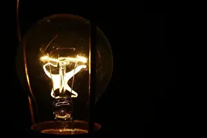 Chandelier Prints: light bulb lit in the dark, concept of idea or imagination